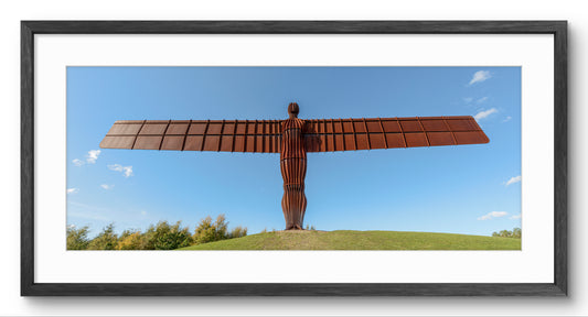 Angel of the North in Blue Sky panoramic print — black frame and white mount