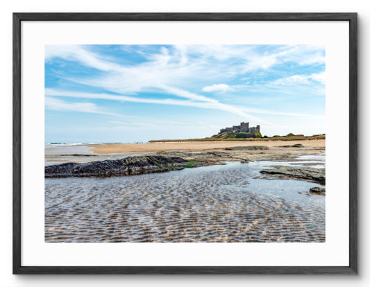 Bamburgh Castle rock pools shown as a framed photographic print.
