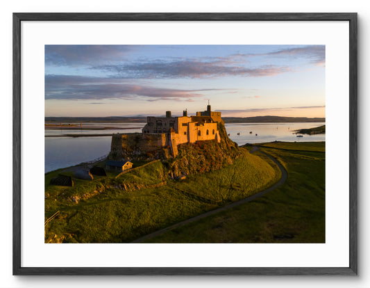 Lindisfarne Castle Sunset - Holy Island - Northumberland shown as a framed photographic print.