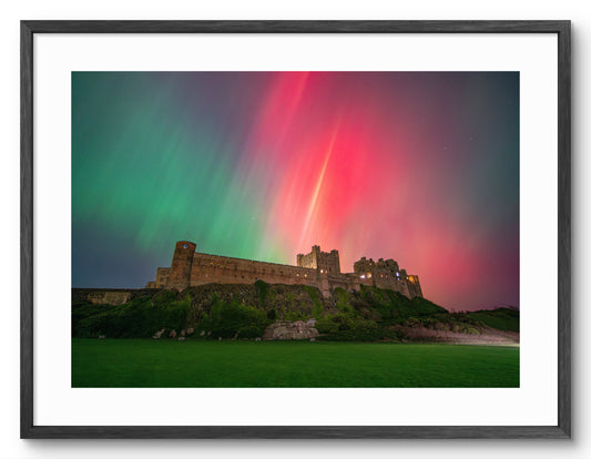 Aurora Borealis above Bamburgh Castle shown as a framed photographic print.