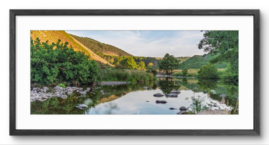 River & Woodland Reflections panoramic print — black frame and white mount