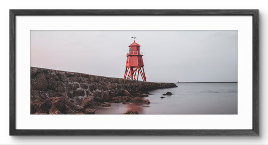 Herd Groyne Lighthouse panoramic print — black frame and white mount