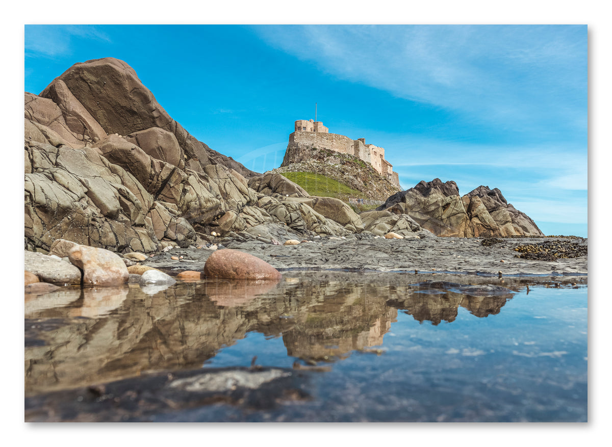 Lindisfarne Castle - Rock Pool Reflections - Holy Island - Northumberland shown as a canvas print.