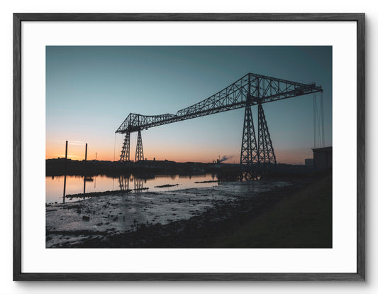 Tees Transporter Bridge - Sunset - Middlesbrough - Teesside shown as a framed photographic print.