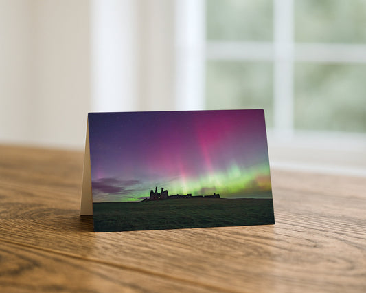Dunstanburgh Castle Northern Lights blank A5 greetings card, Northumberland, by North East Captures