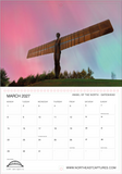 A printed calendar page for March 2027 featuring a photograph of the Angel of the North sculpture in Gateshead under a pink, purple, and green sky. The top portion shows the scenic photo, while the bottom portion contains a white calendar grid with day boxes and text including 'MARCH 2027', 'ANGEL OF THE NORTH - GATESHEAD', and 'WWW.