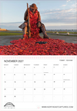 A single-page calendar spread showing a photograph of a seated statue pouring red stones across a paved area, with a November 2027 calendar grid on the lower half and Northeast Captures branding at the bottom.