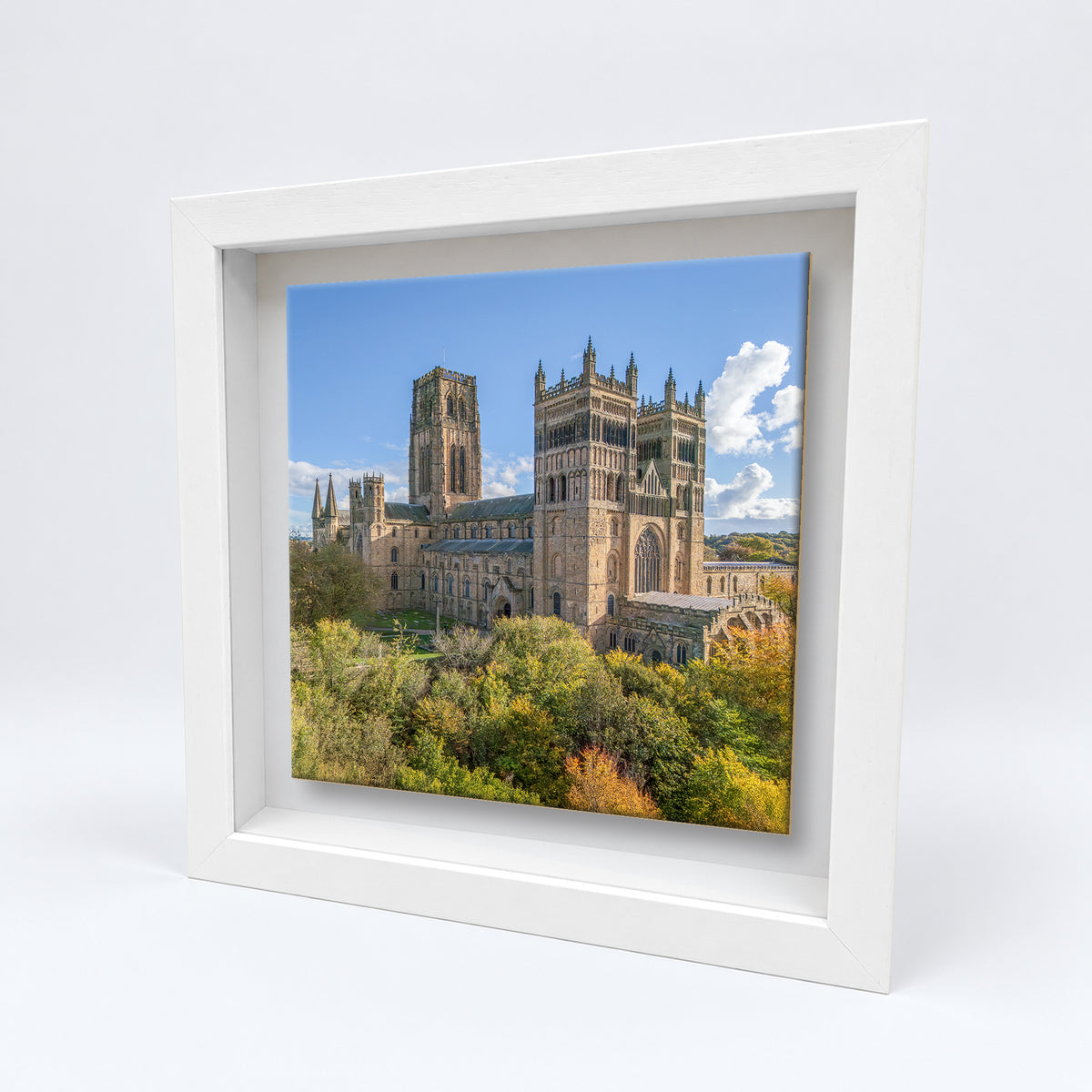 Durham Cathedral ceramic tile in a white solid wood box frame, angled view