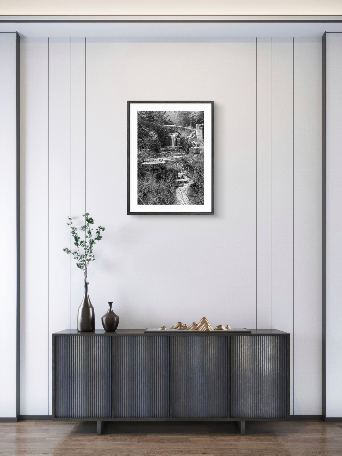 Jesmond Dene Waterfall Black & White Portrait — framed artwork shown in a room