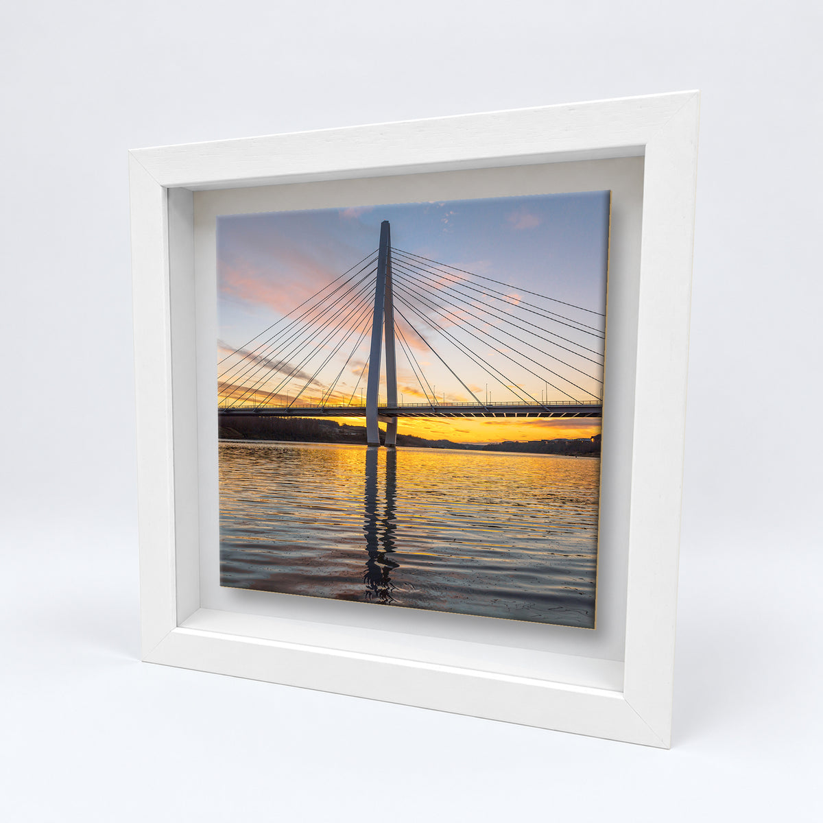 Northern Spire Sunset on an 8×8 inch ceramic tile in a white box frame, angled view