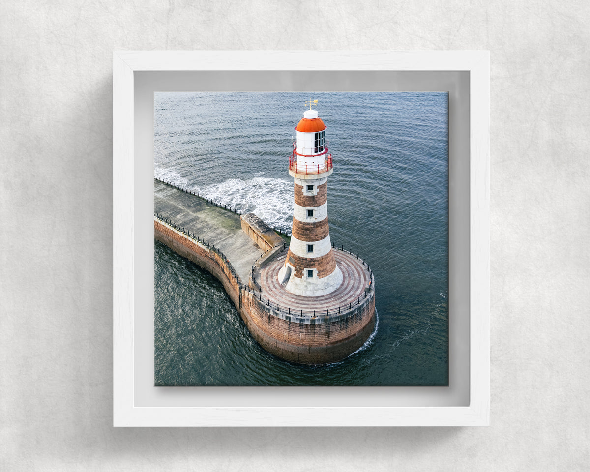 Roker Lighthouse Aerial View on an 8×8 inch ceramic tile in a white box frame, front view