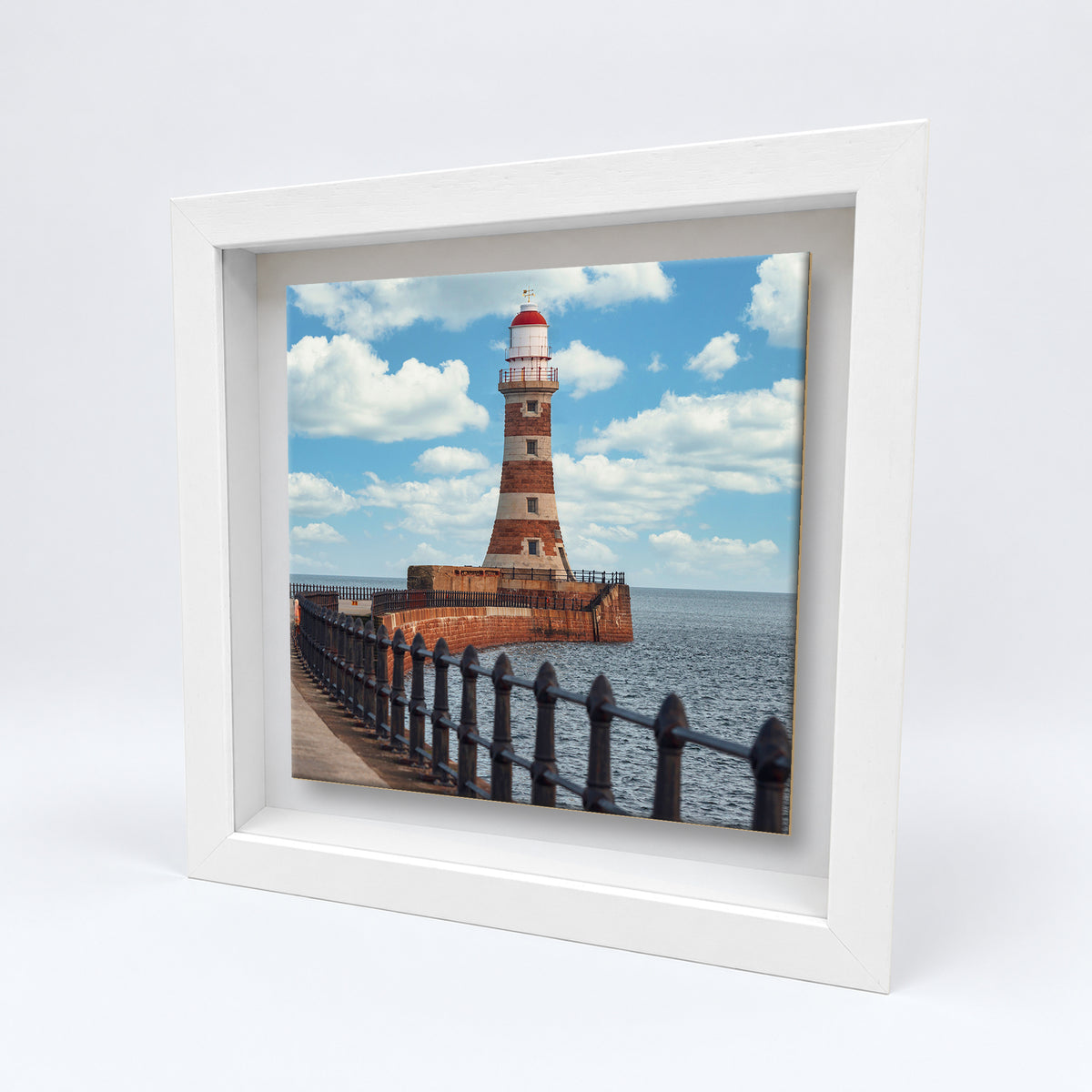 Roker Pier Lighthouse on an 8×8 inch ceramic tile in a white box frame, angled view