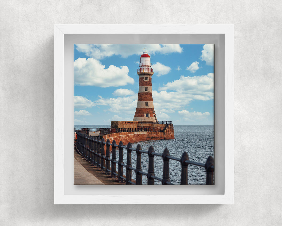 Roker Pier Lighthouse on an 8×8 inch ceramic tile in a white box frame, front view