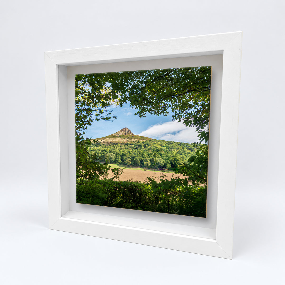 Roseberry Topping on an 8×8 inch ceramic tile in a white box frame, angled view
