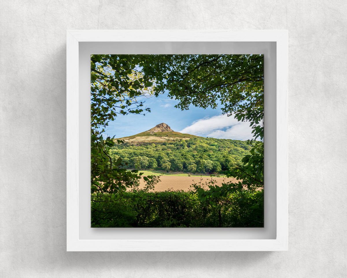 Roseberry Topping on an 8×8 inch ceramic tile in a white box frame, front view