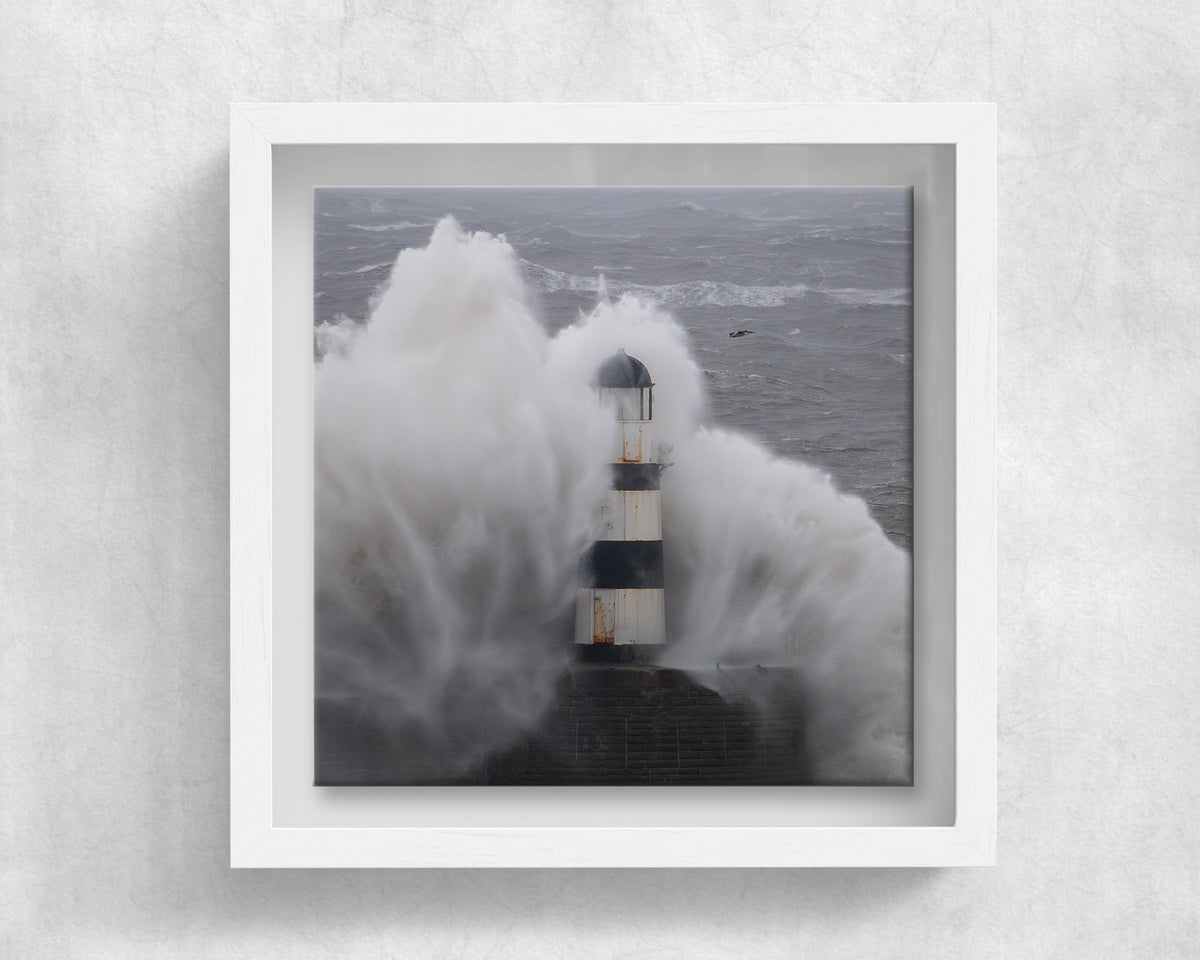 Seaham Lighthouse Storm Babet on an 8×8 inch ceramic tile in a white box frame, front view