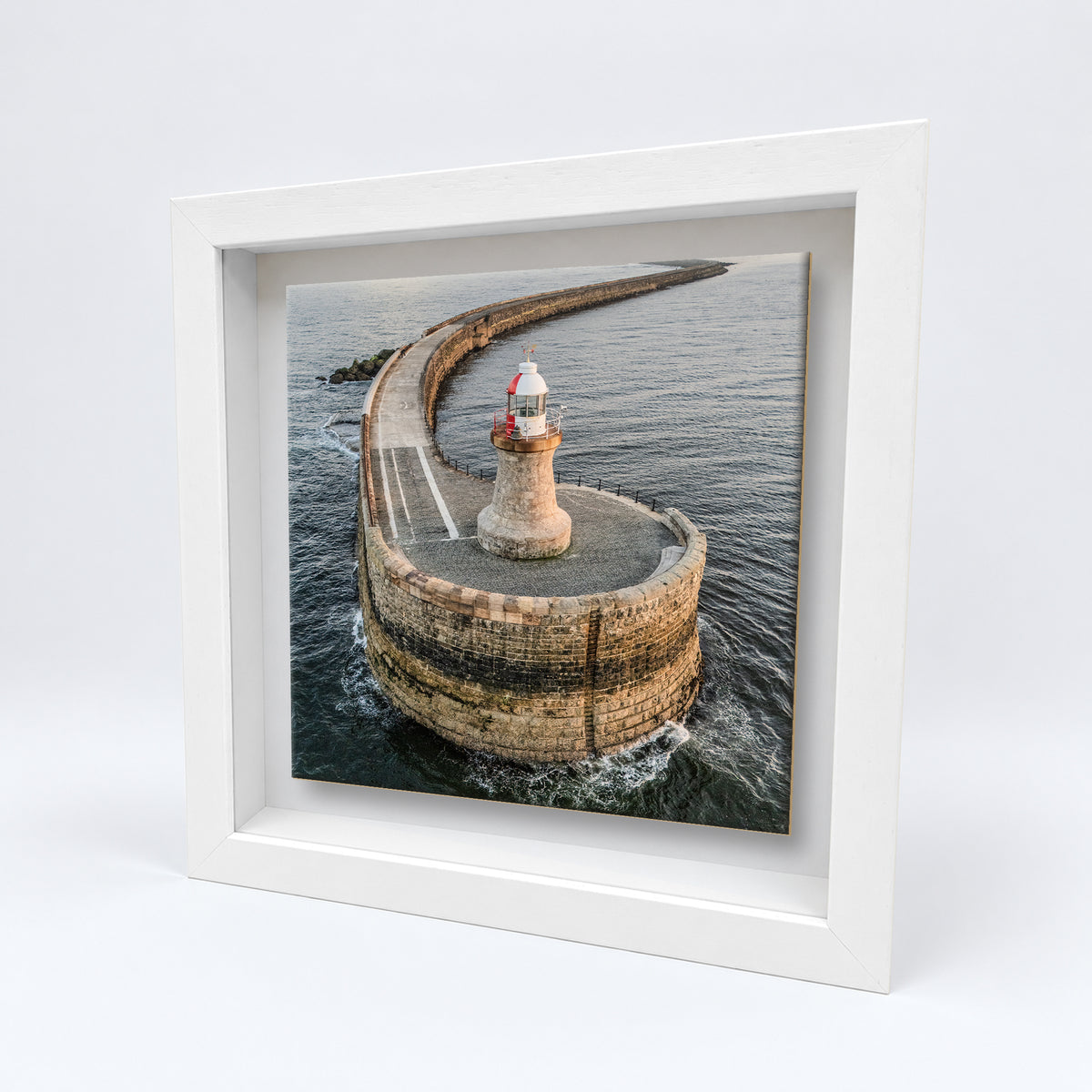 South Shields Lighthouse Aerial on an 8×8 inch ceramic tile in a white box frame, angled view