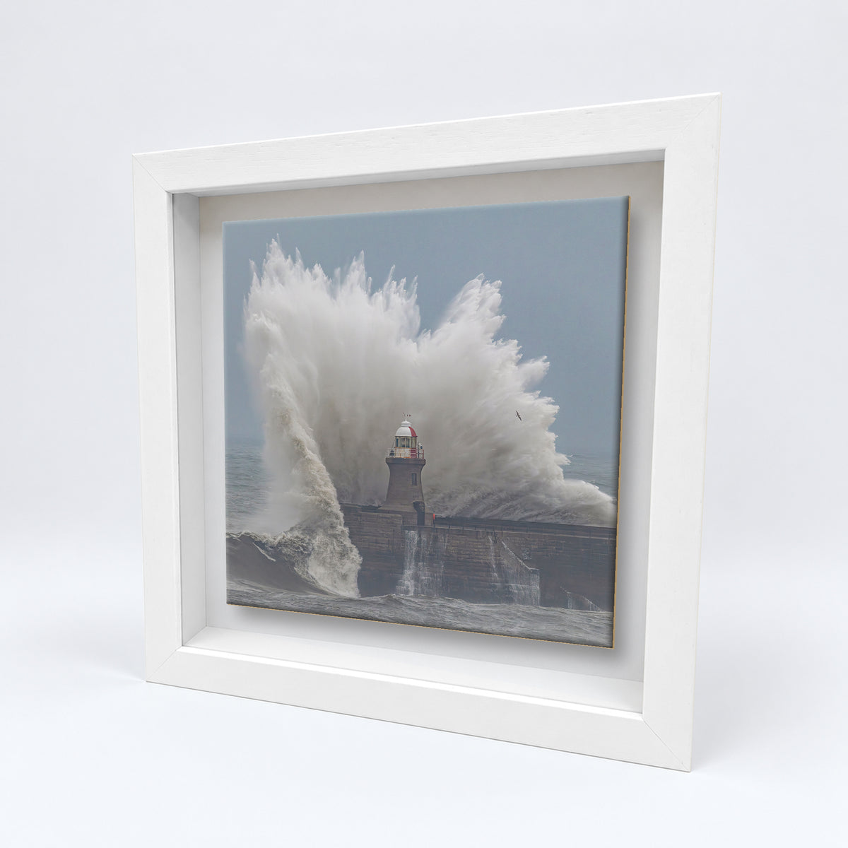 South Shields Pier Storm Waves on an 8×8 inch ceramic tile in a white box frame, angled view