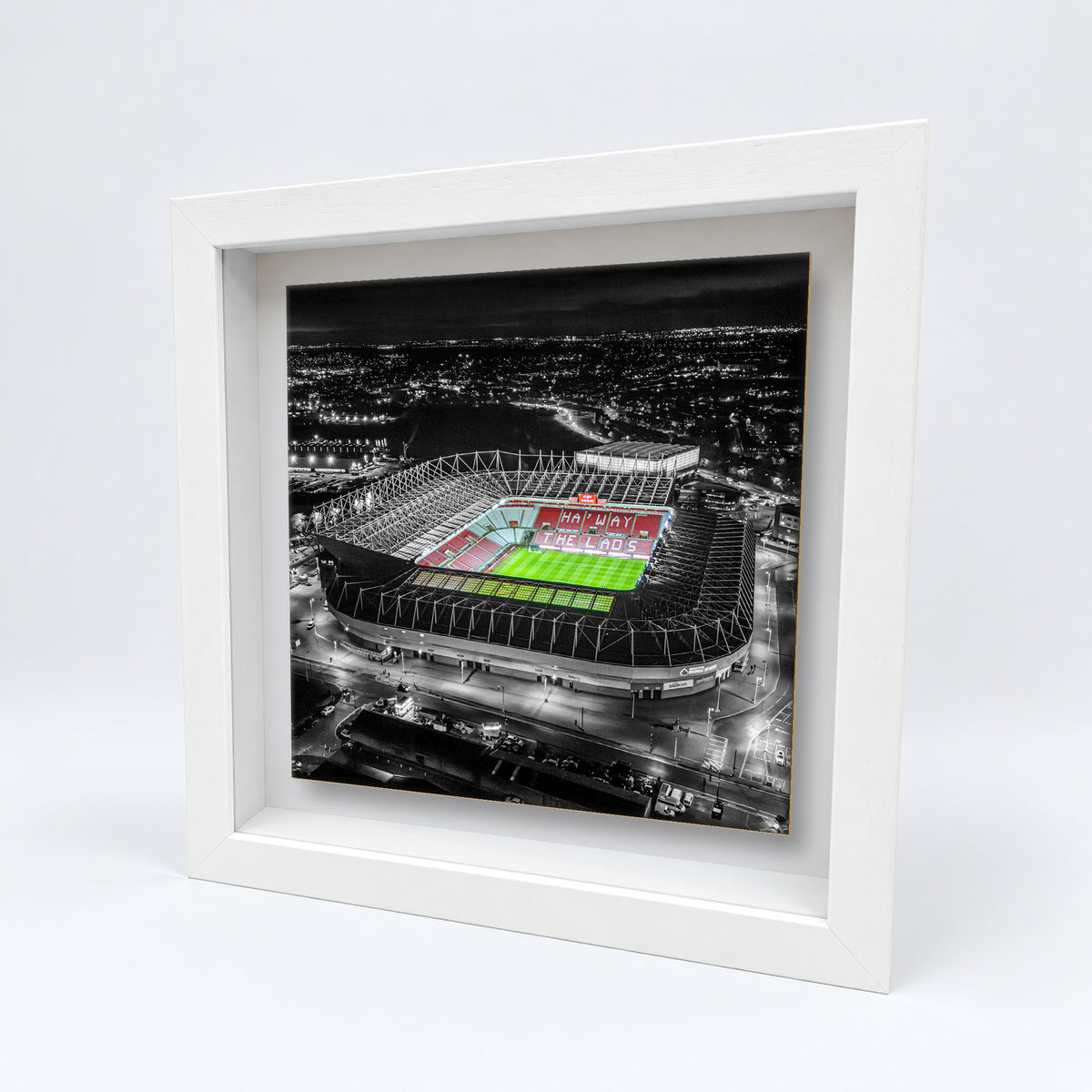 Stadium of Light at Night on an 8×8 inch ceramic tile in a white box frame, angled view
