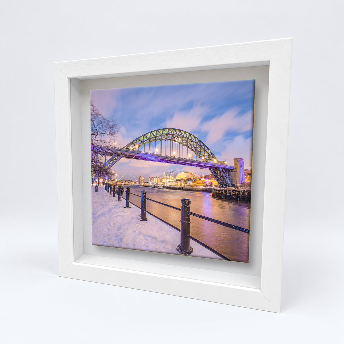Tyne Bridge in Snow on an 8×8 inch ceramic tile in a white box frame, angled view