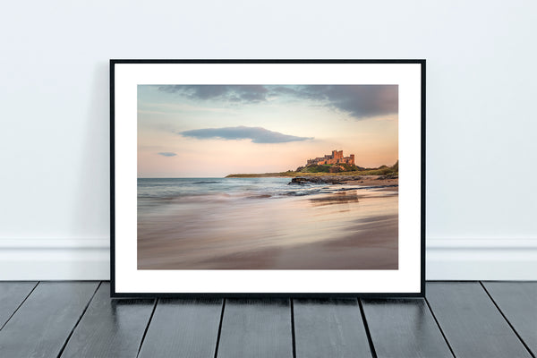 Bamburgh Castle and Beach at Sunset in Northumberland. Perched on the mighty Whin Sill on the North East coast of England. - North East Captures